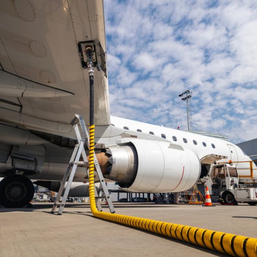 Refueling of airplane at airport. Ground service before flight.